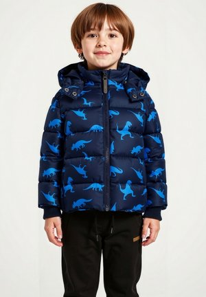 Navy Puffer-Jacke mit blauen Dinosauriermustern, ausgestattet mit einem Reißverschluss auf der Vorderseite und einer verstellbaren Kapuze. Rippbündchen sorgen für zusätzlichen Komfort.