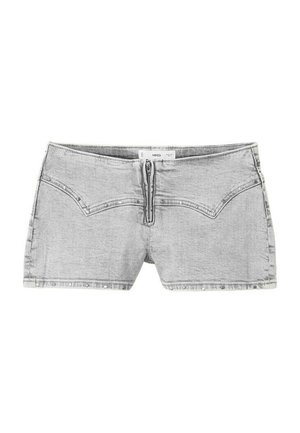 Mini-jupe en jean gris clair avec fermeture éclair à l'avant et coutures décoratives, présentée à plat sur un fond blanc.