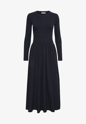 Long-sleeve navy dress with a ribbed bodice and a flowing skirt. Features a round neckline and gathered fabric at the waist. Smooth texture.