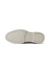 Zapato tipo slip-on con una suela de goma texturizada en gris claro con acentos suaves y un diseño de punta redondeada. Ideal para uso casual.
