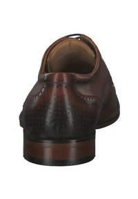 Brown leather dress shoe with perforated design, rounded toe, leather lining, and a stacked heel. Noticeable stitching and sleek silhouette.