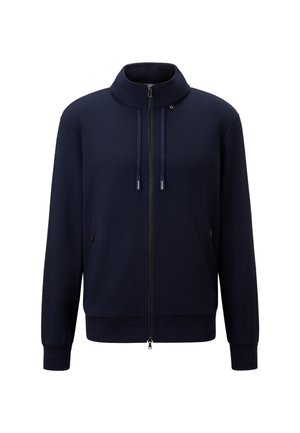 Marineblå zip-up jakke med høj krave, lavet af tekstureret stof. Har snoretræk og sidelommer med lynlåse.