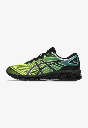 Scarpa da corsa con design a gradiente nero e verde neon, superficie testurizzata e suola con un motivo a onde distintivo dotata di ammortizzazione in gel.