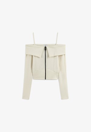Top crema a spalla scoperta, con maniche lunghe, dotato di zip frontale, texture a coste e ampio colletto pieghettato.