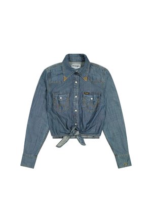Cropped denim shirt with long sleeves, light blue color, button front, collar, two chest pockets, and knotted front detail. Wrangler label visible.