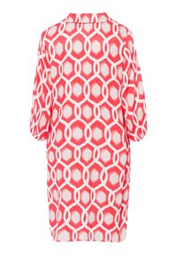 Rood-witte tuniek met geometrisch ontwerp, voorzien van een kraag en driekwart mouwen, gemaakt van lichtgewicht stof.