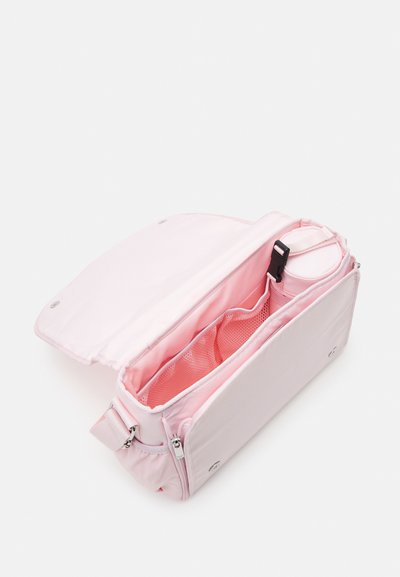 Light pink shoulder bag with a zip closure; interior features mesh pockets and a cylindrical compartment for a water bottle. Smooth texture.