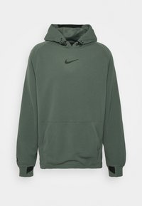 Sweat à capuche Nike vert avec capuche à cordon de serrage réglable, poche kangourou à l'avant, trous pour les pouces aux poignets et logo Nike noir sur la poitrine.