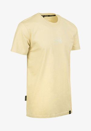 Light yellow cotton t-shirt with a crew neck, short sleeves, and a white logo printed on the front. Features a tag on the lower side.