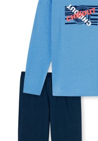 Long-sleeve light blue shirt with "CHILL OUT" graphic and navy blue pants, made of soft fabric with a smooth texture.