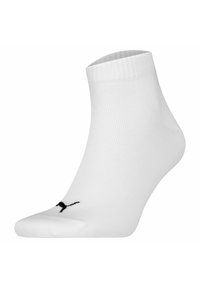 Vit ankelsocka gjord av ribbat tyg med vadderad tå. Har en svart logotyp på sidan och en elastisk mudd för säker passform.