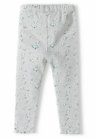 Ljust grå leggings med ribbad textur, prydda med ett spritt blommönster i grönt och blått, samt ett scallop-sydd fåll vid anklarna.