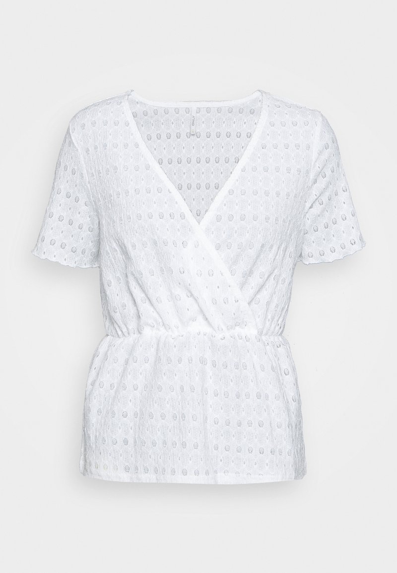 Blouse blanche à manches courtes avec col en V style cache-cœur, taille élastique et tissu texturé avec petits motifs ovales découpés.
