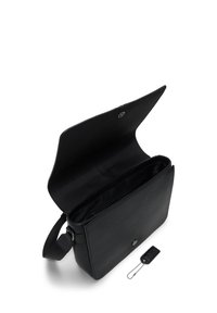 Black leather messenger bag with a flap closure, interior compartments, adjustable strap, and a small tag attached by a chain.