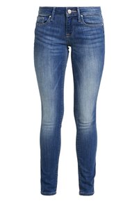 Tunna blå jeans i denim med medelhård tvätt, med framfickor, knappstängning och lätt urtvättning vid låren och knäna.