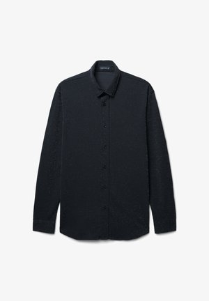Camicia nera a maniche lunghe con una leggera trama a pois, con bottoni sul davanti, colletto e polsini; realizzata in un tessuto morbido.