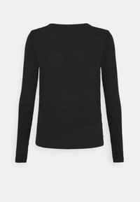 Musta pitkähihaisena ribbipaita, jossa on pyöreä pääntie ja tiukka siluetti, tasaisella materiaalilla ja saumatonta muotoilua.