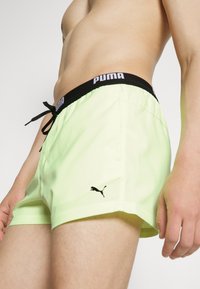 Puma SWIM MEN LOGO - Plaukimo šortai - fast yellow