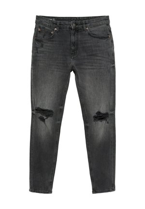 Jean slim noir avec déchirures usées aux deux genoux et légère décoloration sur les cuisses et les poches.