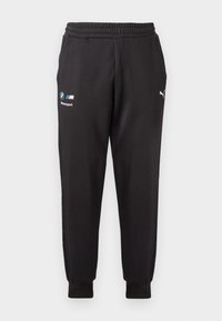 Černé tepláky Puma s logy BMW Motorsport a Puma, elastickým pasem, kapsami a manžetami na nohavicích.