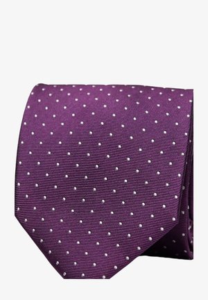 Violetti solmio, jossa on valkoisia pilkkuja, teksturoitu kangas ja terävä kärki. Malli on tasaisesti jakautunut pinnan yli.