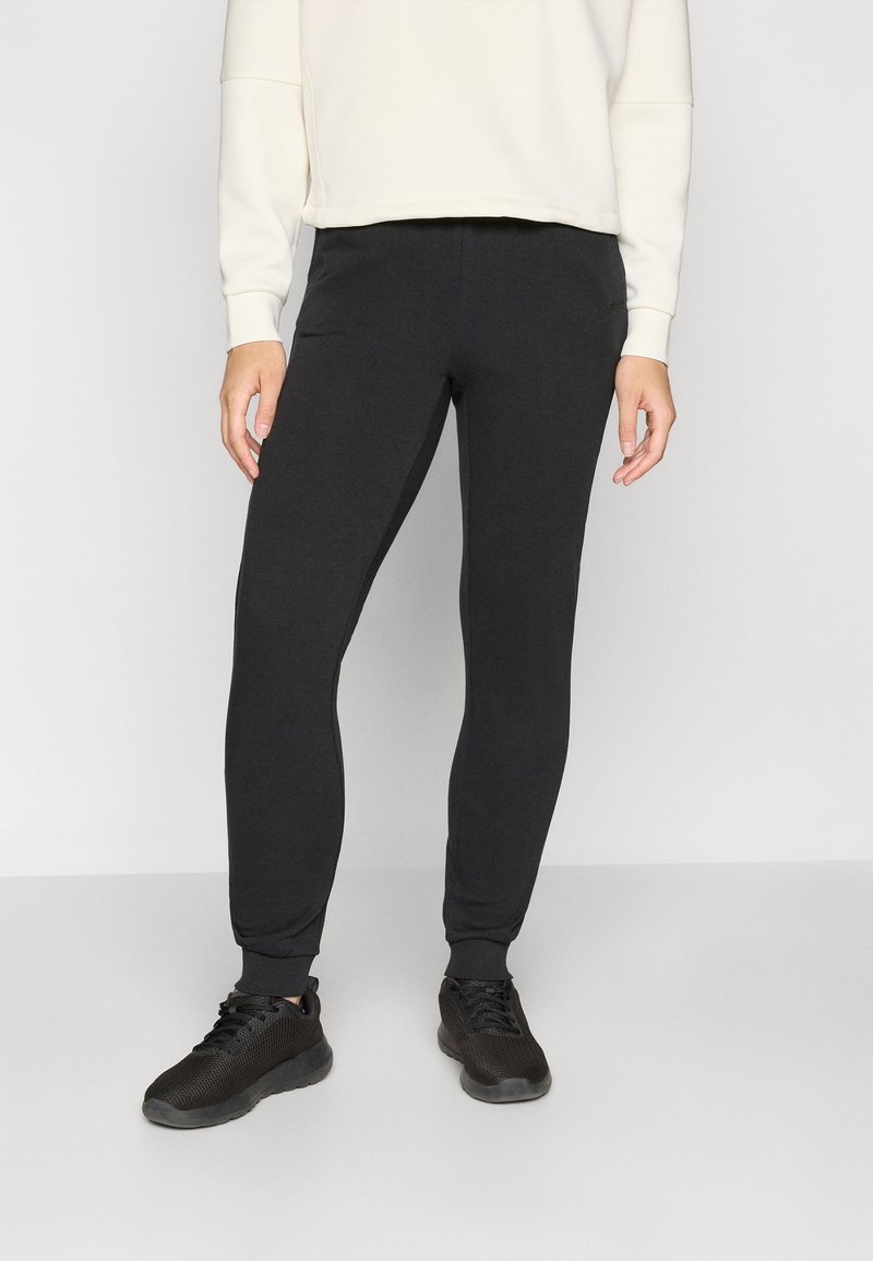 Sorte, tapered sweatpants lavet af blødt materiale med en glat tekstur, der har en elastisk talje og manchetter for komfort.