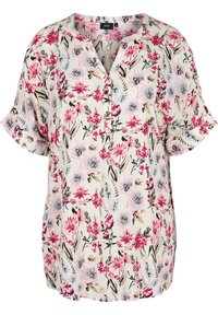 Květinová tunika s krátkými rukávy, která má krémové pozadí. Design zahrnuje růžové a modré květy s zelenými listy. Hlavní část s knoflíky.