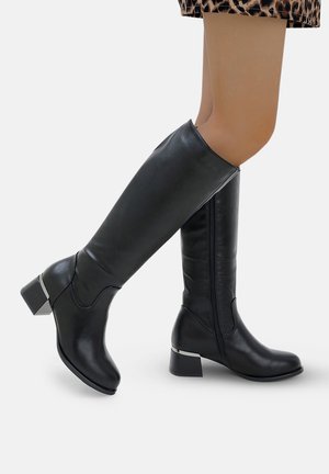 Black knee-high boots made of smooth leather with a chunky heel and silver accent on the heel, featuring a side zipper for easy wear.