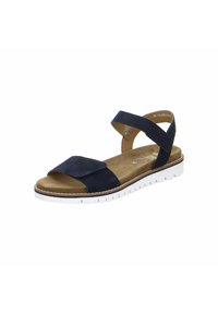 Navy suede sandal with a wide toe strap, ankle strap, and a textured white rubber sole. Features a flat design and cushioned footbed.