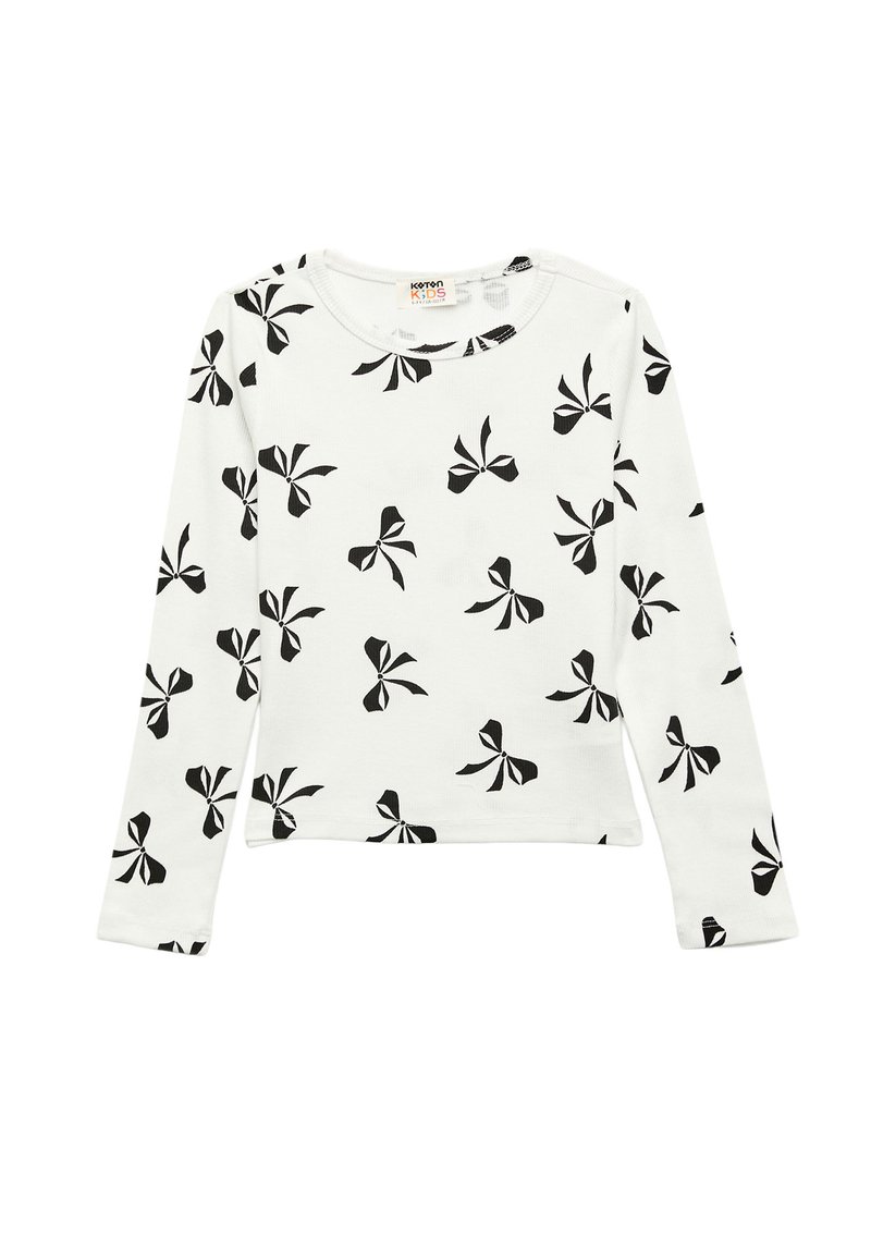 Witte lange blouse van katoen met een zwart strikpatroon, ronde halslijn en rechte zoom. Zachte textuur, casual pasvorm.