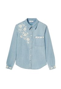 Chemise en denim bleu clair à manches longues, avec fermeture à boutons et broderie florale blanche sur la poitrine et la poche. Texture douce, col structuré.