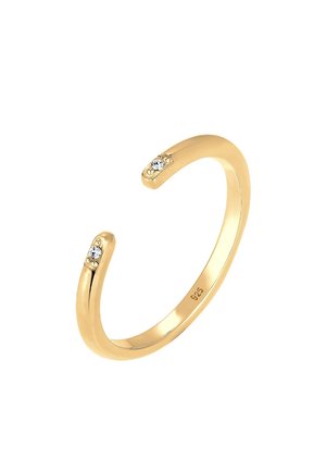 Gouden open cuffring met twee kleine heldere stenen aan de uiteinden, gladde afwerking en gestempeld met "925" aan de binnenband.