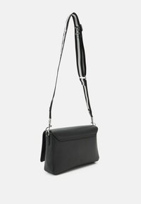 Black leather shoulder bag with a structured shape, featuring silver hardware and a detachable strap with black and gray stripes.