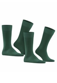 Grüne Baumwollsocken in einem einfachen Rippdesign, mit einfarbiger Optik und einer mittellangen Beinlänge, präsentiert in einer Gruppe von vier.