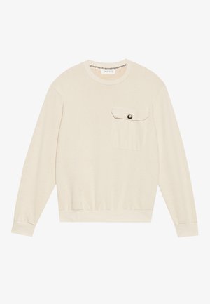 Κρεμ μπλούζα με στρογγυλή λαιμόκοψη, μακριά μανίκια, ριμπ μανσέτες, ελαστική μέση και μπροστινή τσέπη με κουμπί που κλείνει.