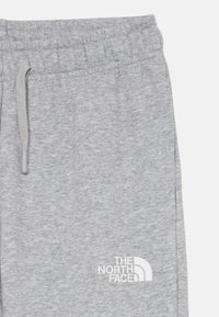 The North Face REGULAR TAPERED JOGGERS UNISEX - Träningsbyxor - light grey heather