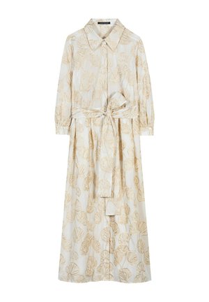 Long cream dress with beige leaf print, long sleeves, button-up front, collar, and matching fabric belt tied at waist.