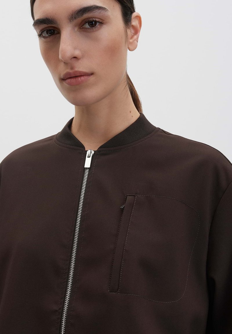 Giacca a vento in nylon Loose Fit - Nero - UOMO | H&M IT