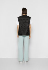 iets frans... REVERSIBLE QUILTED GILET - Colete - black
