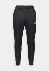 Zwarte sportbroek met een gladde textuur, voorzien van witte zijstrepen en roze accenten op de onderbenen. Elastische tailleband.