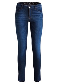 Jeans ajustados en denim índigo oscuro, con una cintura alta, trabillas para cinturón, bolsillos frontales y un cierre de cremallera con botón.