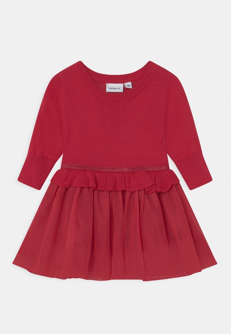 Robe rouge en maille à manches longues avec taille froncée et jupe longue et transparente pour fillettes.