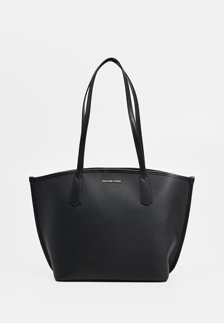 Borsa tote nera Michael Kors con doppi manici e logo dorato su superficie in pelle liscia e testurizzata.