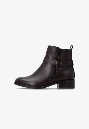 Bottine en cuir marron foncé avec petit talon bloc, sangle décorative avec boucle métallique et languette à l'arrière.