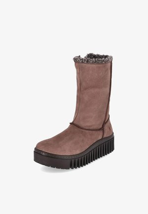 Bota marrón hasta la mitad de la pantorrilla con suela negra gruesa estriada y forro de piel gris visible en la abertura superior.