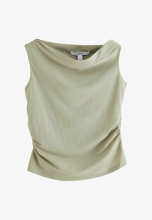 Šviesiai žalias, be rankovių, viršus su drapiruotu iškirptės kraštu, surinktais šonais ir lygiu, minkštu tekstūra. Paprastas ir modernus dizainas.