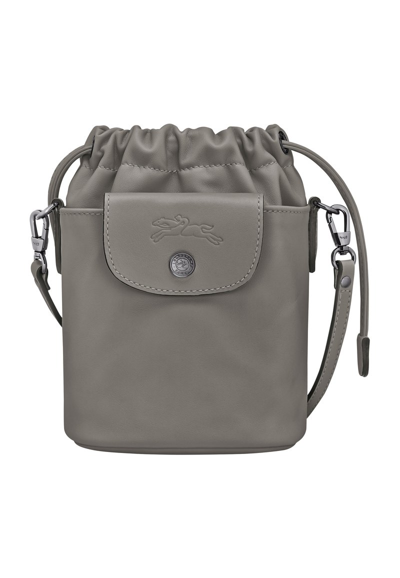 Gray leather drawstring bag with a front pocket, metallic hardware, and adjustable strap. Features a logo embossed on the flap.