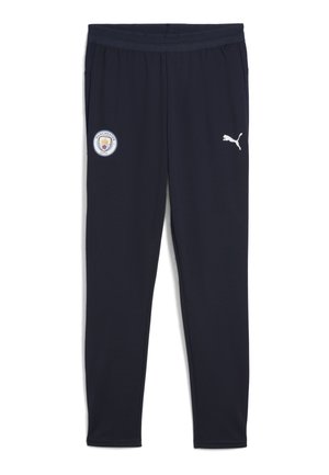 Navyfarbene Sporthosen mit einem Manchester City-Logo und einem weißen Puma-Emblem an der Seite, geeignet für Sport und Freizeit.