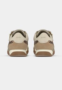 Beige suede sneakers with gold accents and leopard print sides. Rounded shape, cushioned heel, and thick rubber outsole for support.