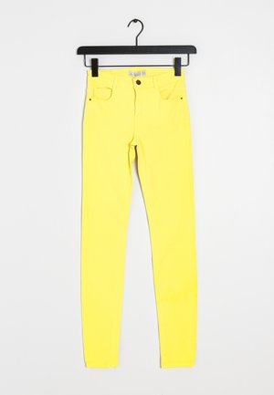 Gele skinny jeans van een katoenen mix, met vijf zakken, een knoopsluiting en riemlussen. Glad textuur met een levendige kleur.